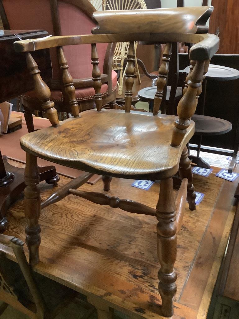 A Victorian elm and beech smoker's bow chair